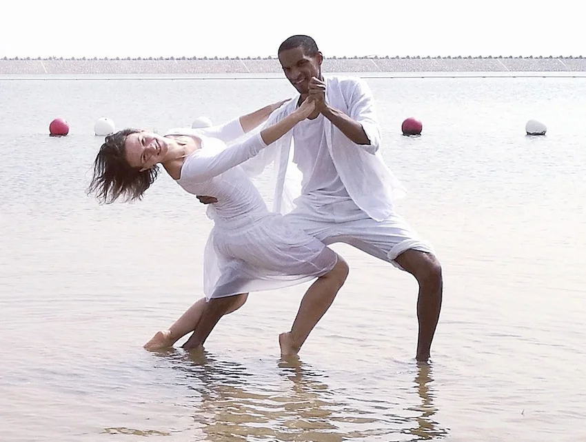 Salsa dance partners holding each other